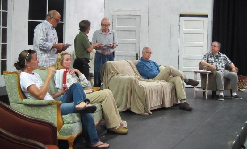 A rehearsal of Possum Point Players upcoming dinner theater, "And Then There Were None," finds (l-r) Kim Klabe of Rehoboth Beach, John Marino of Lewes, Sharon George of Bridgeville, Doug Friend of Lewes, John Levine of Smyrna, Dennis McGeady of Bridgeville, and Thomas Scott Roberts of Lewes discussing the strange manner in which each of them has been invited to an island mansion. SOURCE SUBMITTED